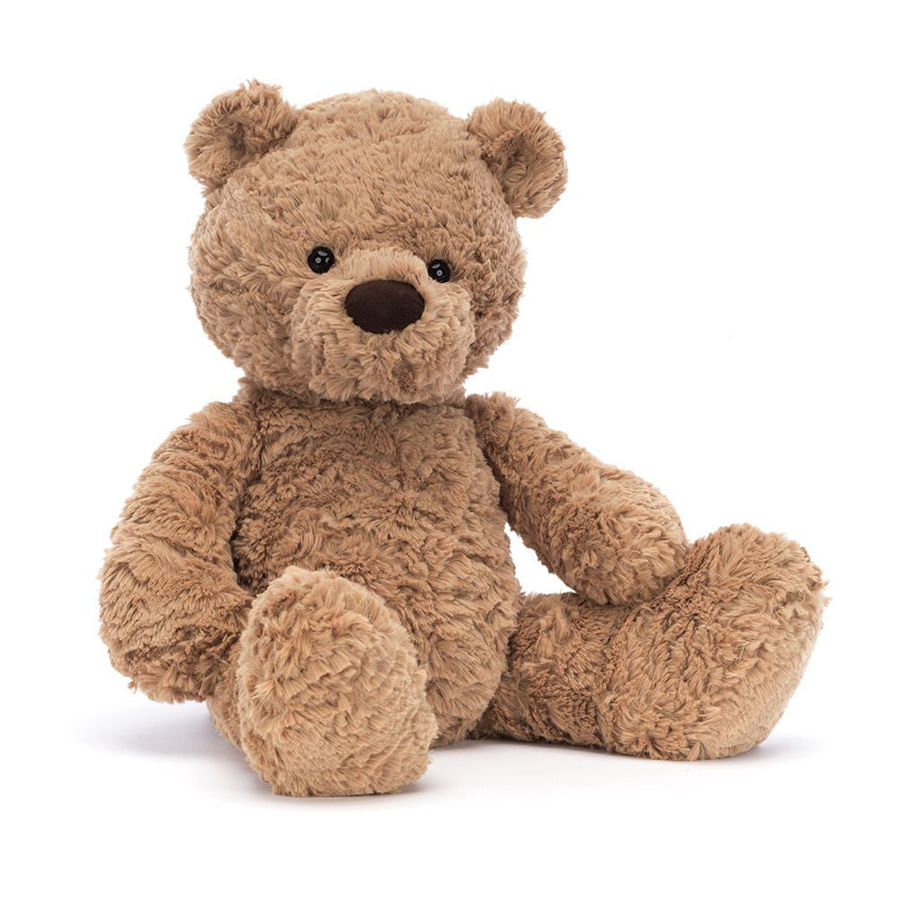 Bumbly Bear Medium by JellyCat sitting down, showcasing its plush brown fur and cute facial features.