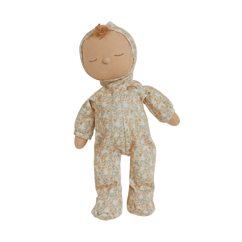 A close-up view of the Dozy Dinkum Custard plush toy by Olli Ella, featuring its floral outfit and charming embroidered face. The plush stands against a white background, emphasizing its adorable design.