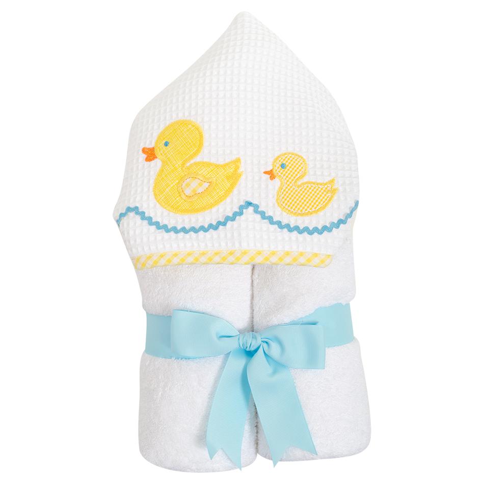 Hooded towel featuring yellow ducks design by 3 Marthas, titled '3 Marthas Everykid Hooded Towel Yellow Ducks', rolled with a blue ribbon.