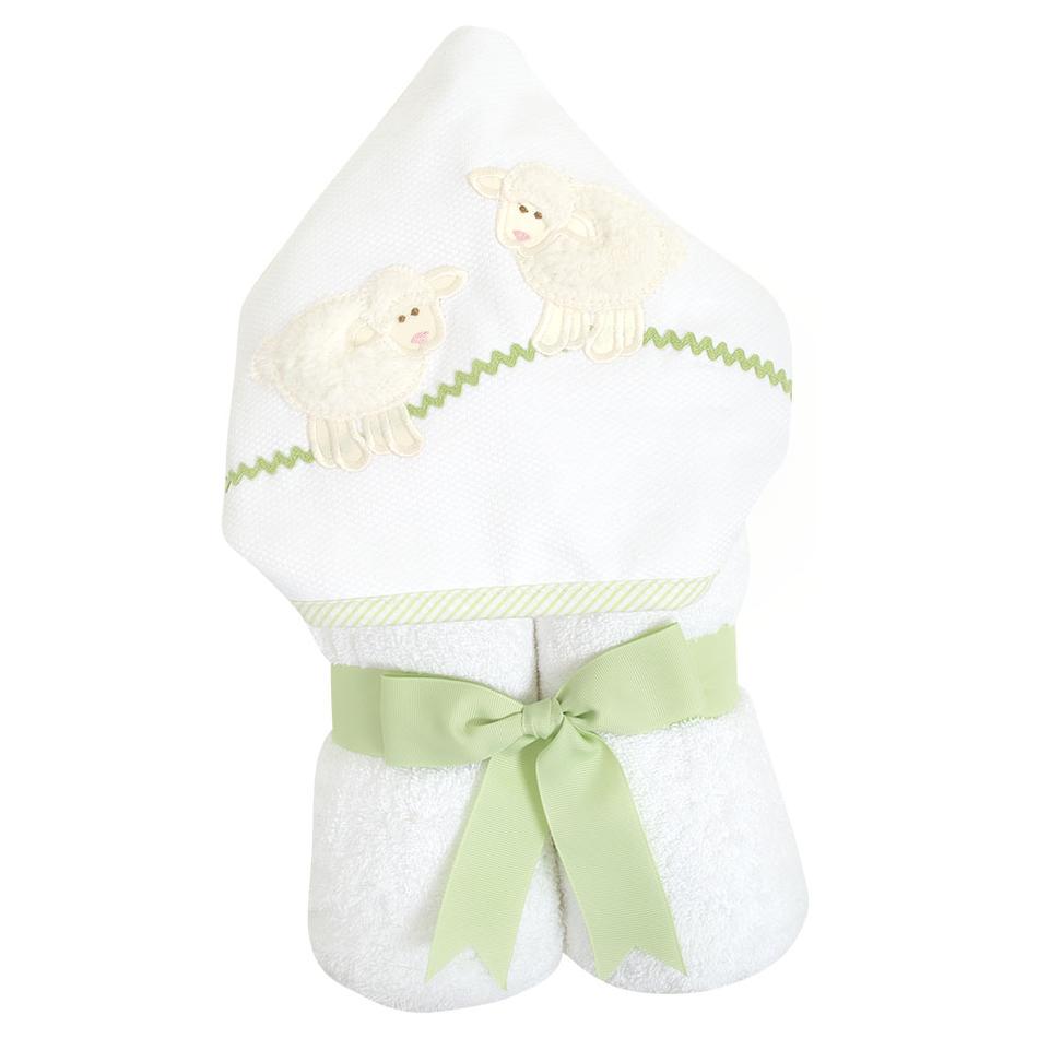 3 Marthas Everykid Hooded Towel featuring a charming White Lamb design, beautifully wrapped with a green ribbon. This cozy towel is perfect for kids, showcasing adorable lamb appliques and a terry lined hood, making bath time fun and stylish.